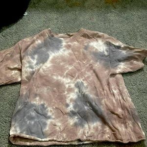 A medium tie dye looking shirt.